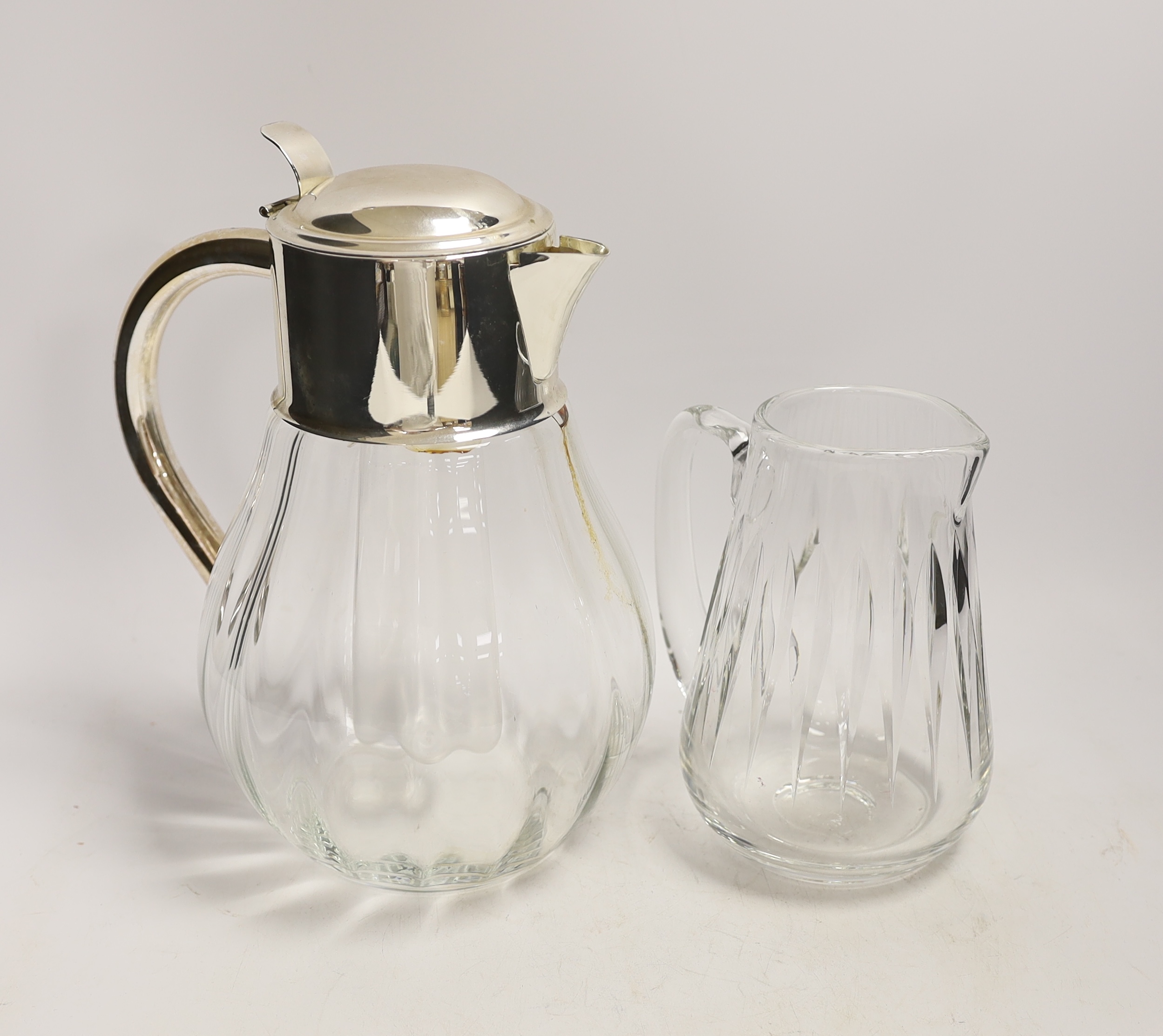 A silver plate mounted lemonade / Pimms jug and a glass jug, largest 28cm (2)